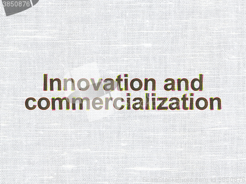 Image of Science concept: Innovation And Commercialization on fabric texture background