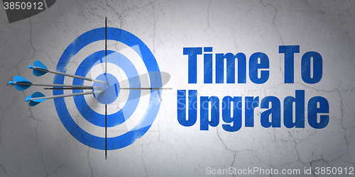 Image of Time concept: target and Time To Upgrade on wall background