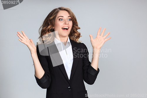 Image of Portrait of young woman with shocked facial expression