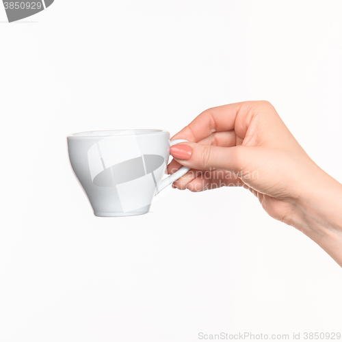 Image of Woman hand with cup on white background