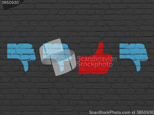 Image of Social network concept: thumb up icon on wall background
