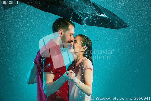 Image of The loving couple in the rain