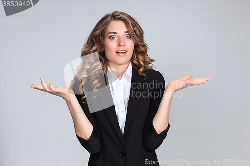 Image of Portrait of young woman with shocked facial expression