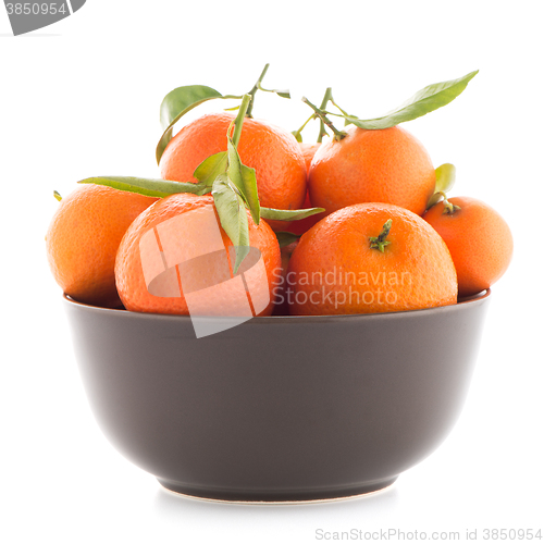 Image of Tangerines on ceramic brown  bowl 