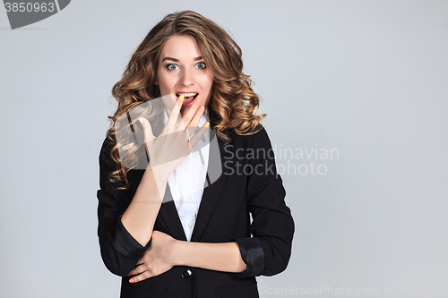 Image of Portrait of young woman with shocked facial expression