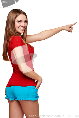 Image of Back view of a young female pointing at copy space