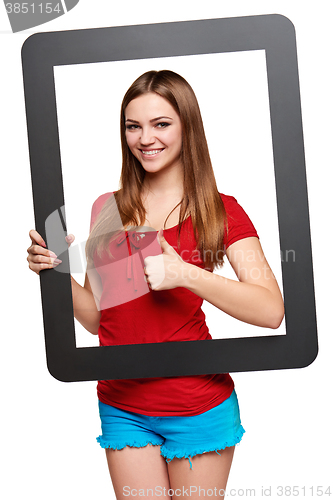 Image of Female looking through the frame giving thumb up