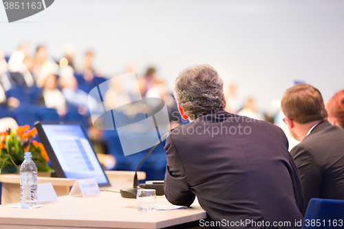 Image of Speaker at Business Conference and Presentation.