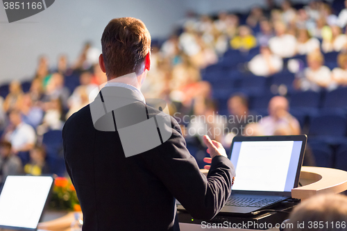 Image of Speaker at Business Conference and Presentation.