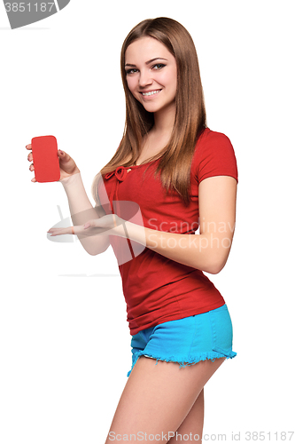 Image of smiling teen girl holding blank credit card