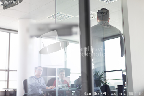 Image of Business team leader delivering presentation in office.