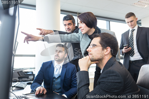 Image of Business team working in corporate office.