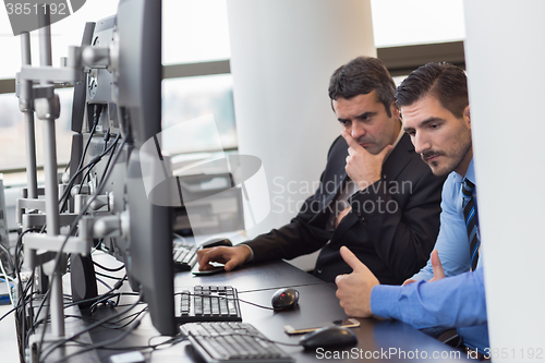 Image of  Concerned stock traders in trading office.