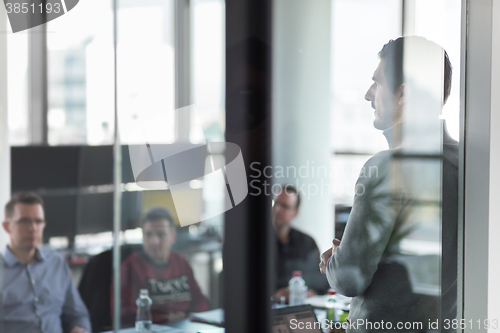 Image of Business team leader delivering presentation in office.