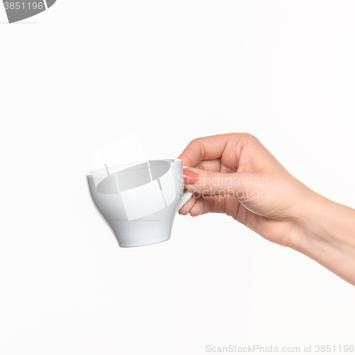 Image of Woman hand with cup on white background