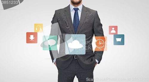 Image of close up of businessman in suit with menu icons