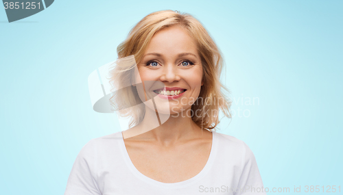 Image of smiling woman in blank white t-shirt