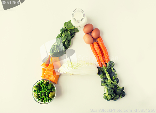 Image of close up of ripe vegetables in a letter shape  