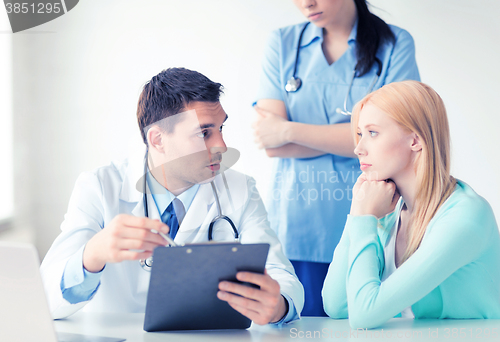 Image of male doctor with patient