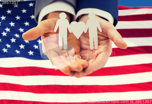 Image of close up of happy male gay couple with love symbol