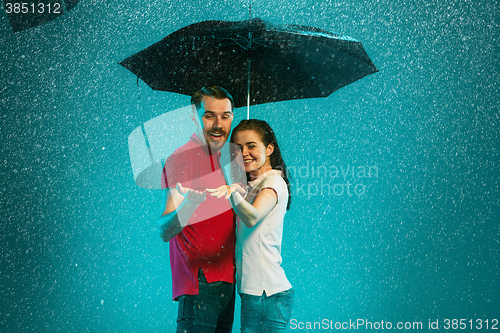 Image of The loving couple in the rain