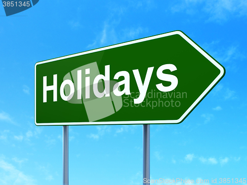 Image of Entertainment, concept: Holidays on road sign background