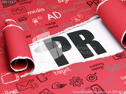 Image of Marketing concept: black text PR under the piece of  torn paper