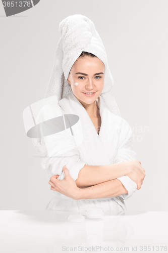 Image of Cute nice girl with cream in her face