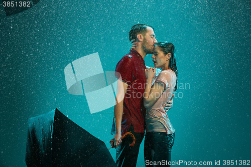 Image of The loving couple in the rain