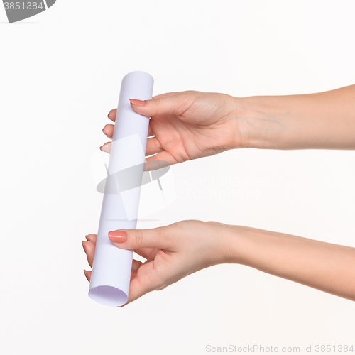 Image of The cylinder female hands on white background