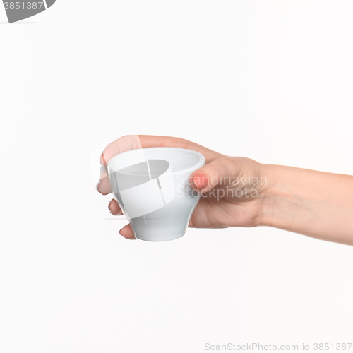 Image of Woman hand with cup on white background