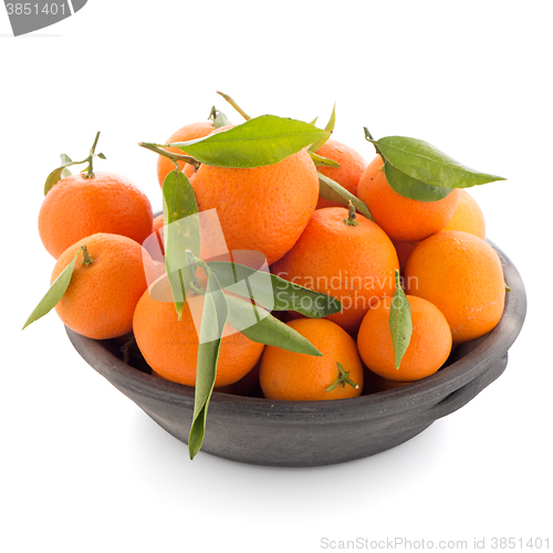 Image of Tangerines on clay bowl 