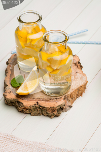Image of Lemon and lime slices in jars