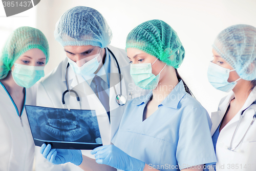 Image of young group of doctors looking at x-ray