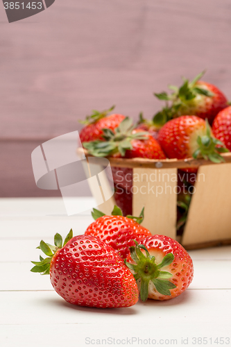 Image of Strawberries in a small basket and lemon