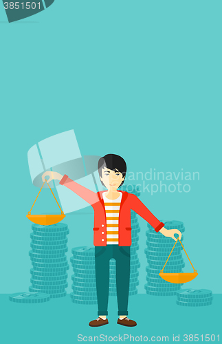 Image of Businessman with scales.