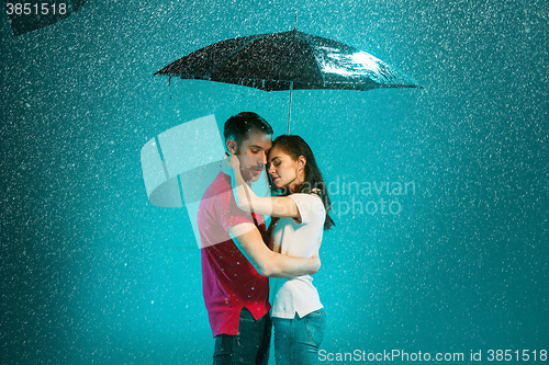 Image of The loving couple in the rain