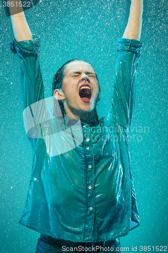 Image of The portrait of young beautiful woman in the rain