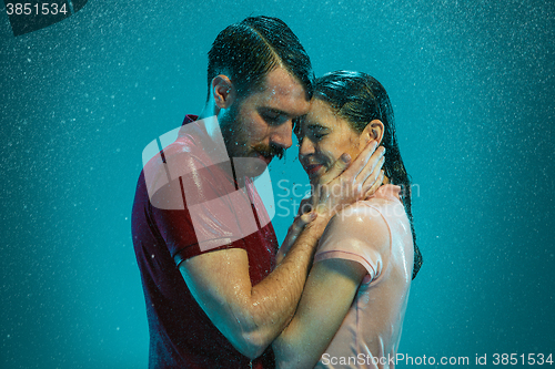 Image of The loving couple in the rain