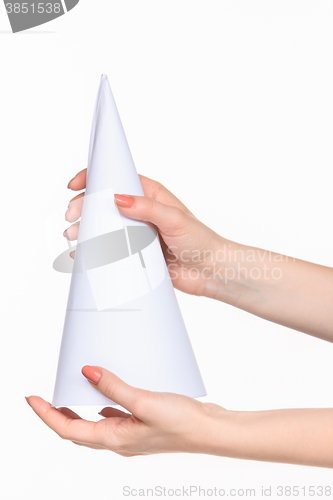 Image of The cone in female hands on white background