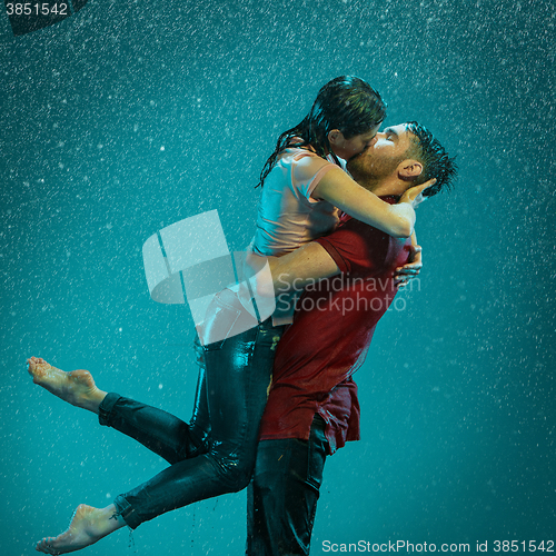 Image of The loving couple in the rain