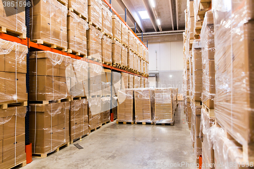 Image of cargo boxes storing at warehouse shelves