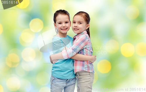Image of happy smiling little girls hugging