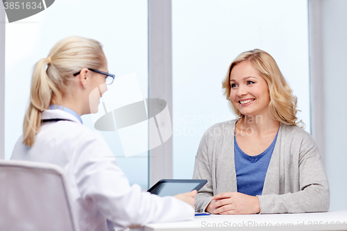 Image of doctor with tablet pc and woman at hospital