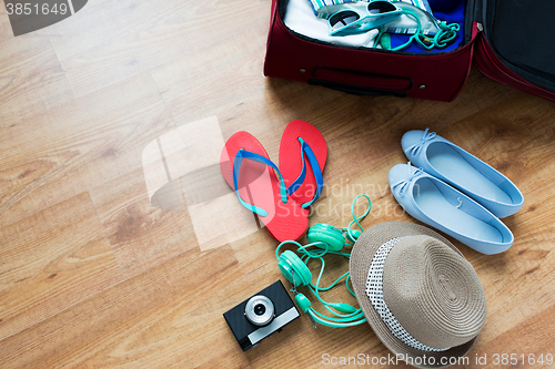 Image of close up of travel bag with clothes and stuff