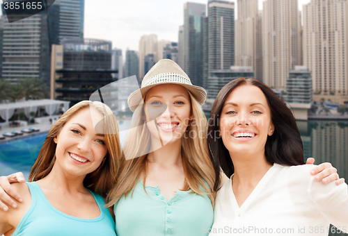 Image of young women over dubai city harbour and boats