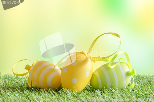 Image of Easter eggs with patterns on green turf