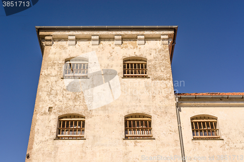 Image of Prison building with bars on windows