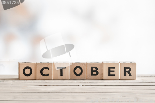 Image of October sign made of wooden cubes