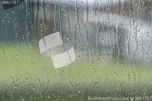 Image of Window to a garden on a rainy day